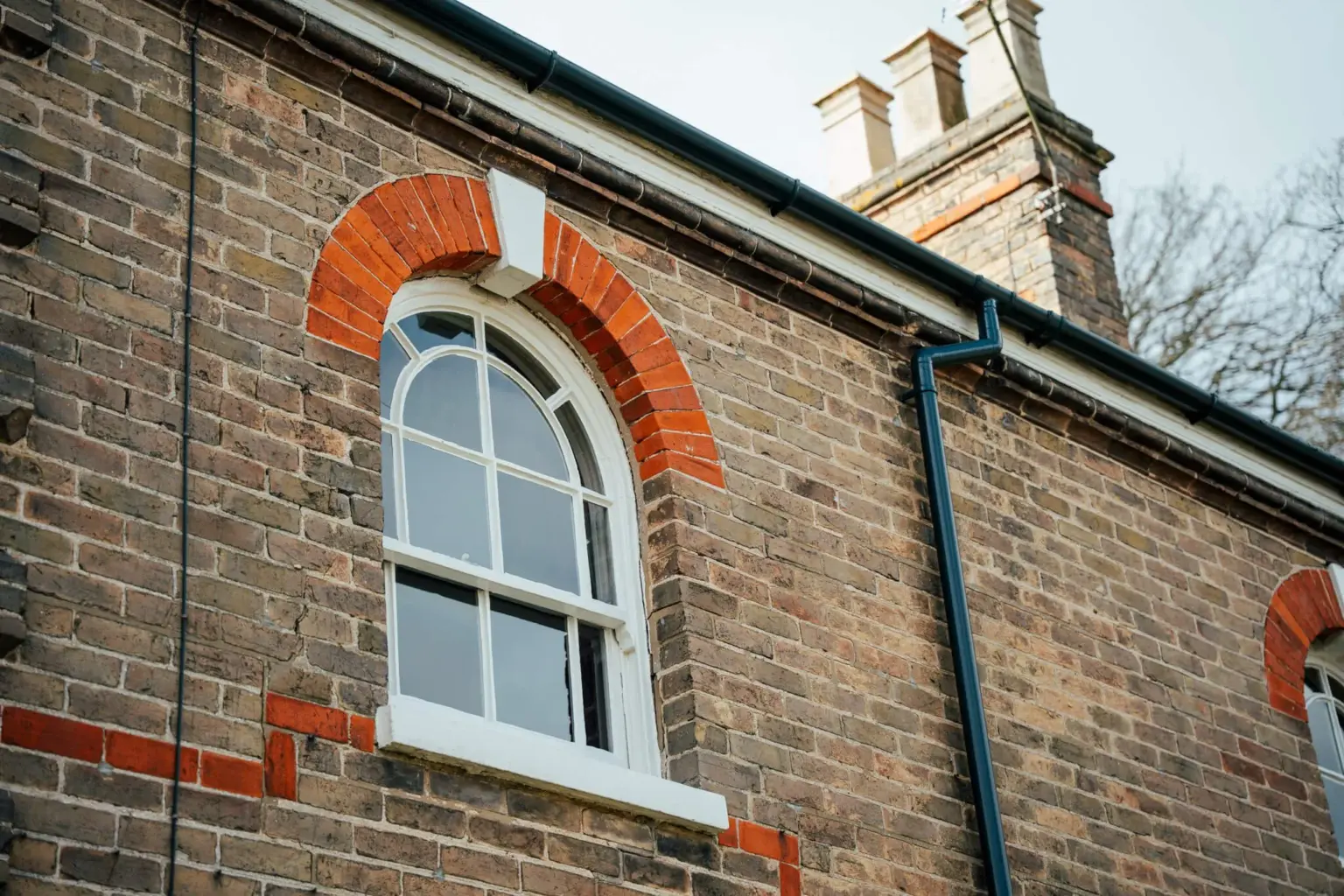 Close up of upper arched sliding sash window
