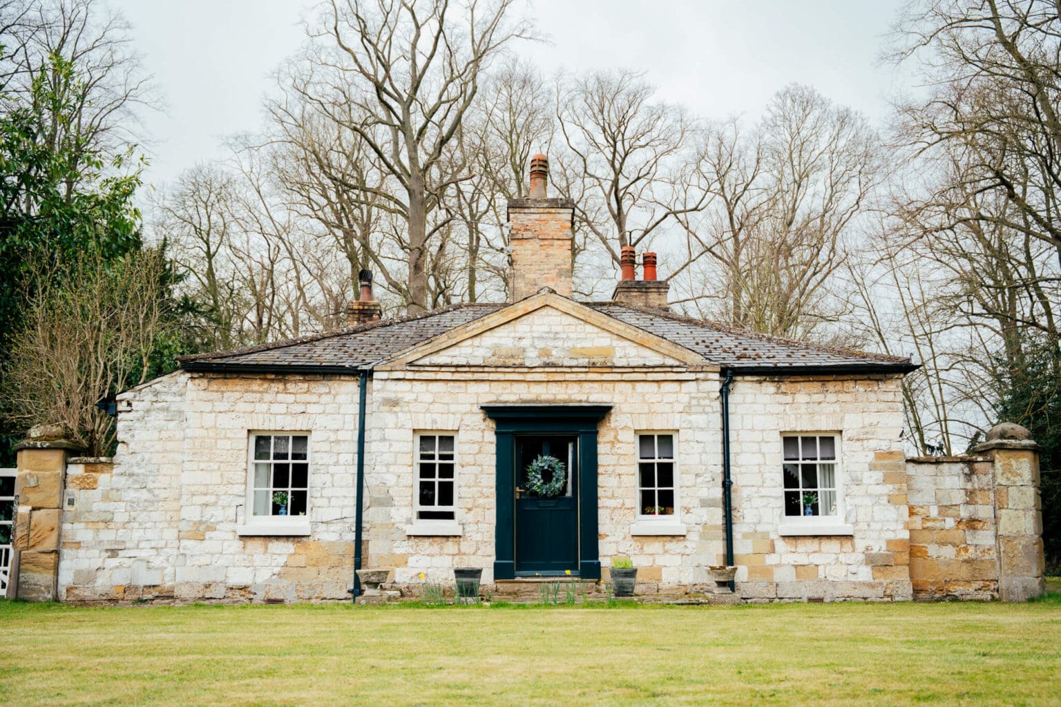Bespoke windows manufactured by Pelham Joinery shown installed on a rustic stone property