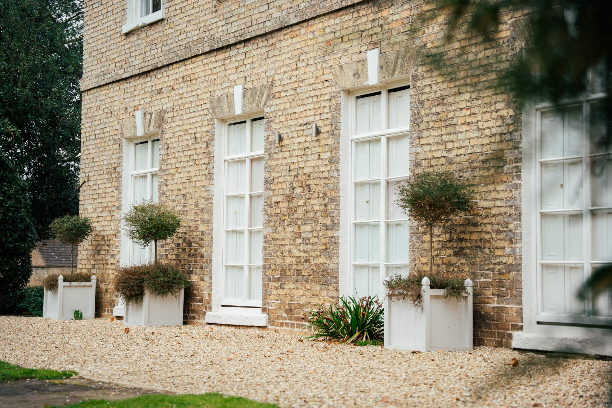 Tall windows with folding screens made bespoke by Pelham Joinery